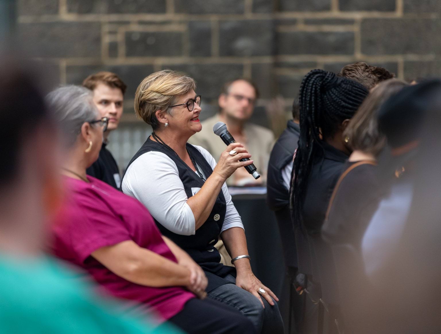 Woman asking question at Treaty forum