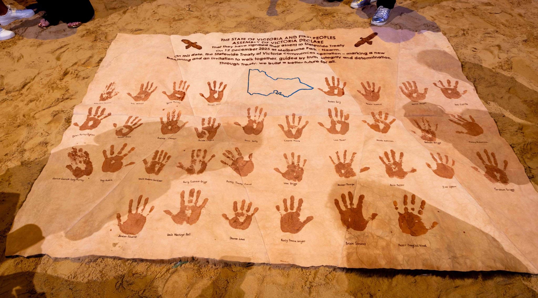 Signed Treaty with ochre handprints on kangaroo skin